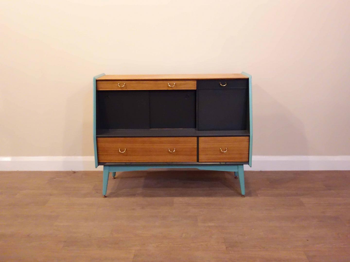 G-Plan Tola Drink Cabinet This piece has been cleaned, painted and restored in our London based workshop, using Little Greene 'Lamp Black' paint and wood oil. Height: 98cm, Width: 122cm, Depth: 60cm