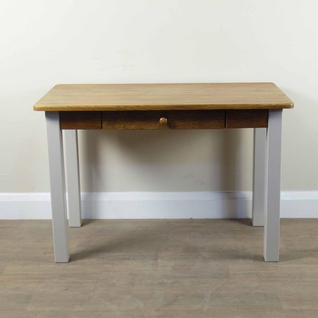 Aspace Solid Wood Desk with one drawer Height: 73cm, Width: 110cm, Depth: 60cm This item was cleaned, painted and restored in our London based workshop, using Little Greene 'Mushroom' paint, stain and clear varnish.