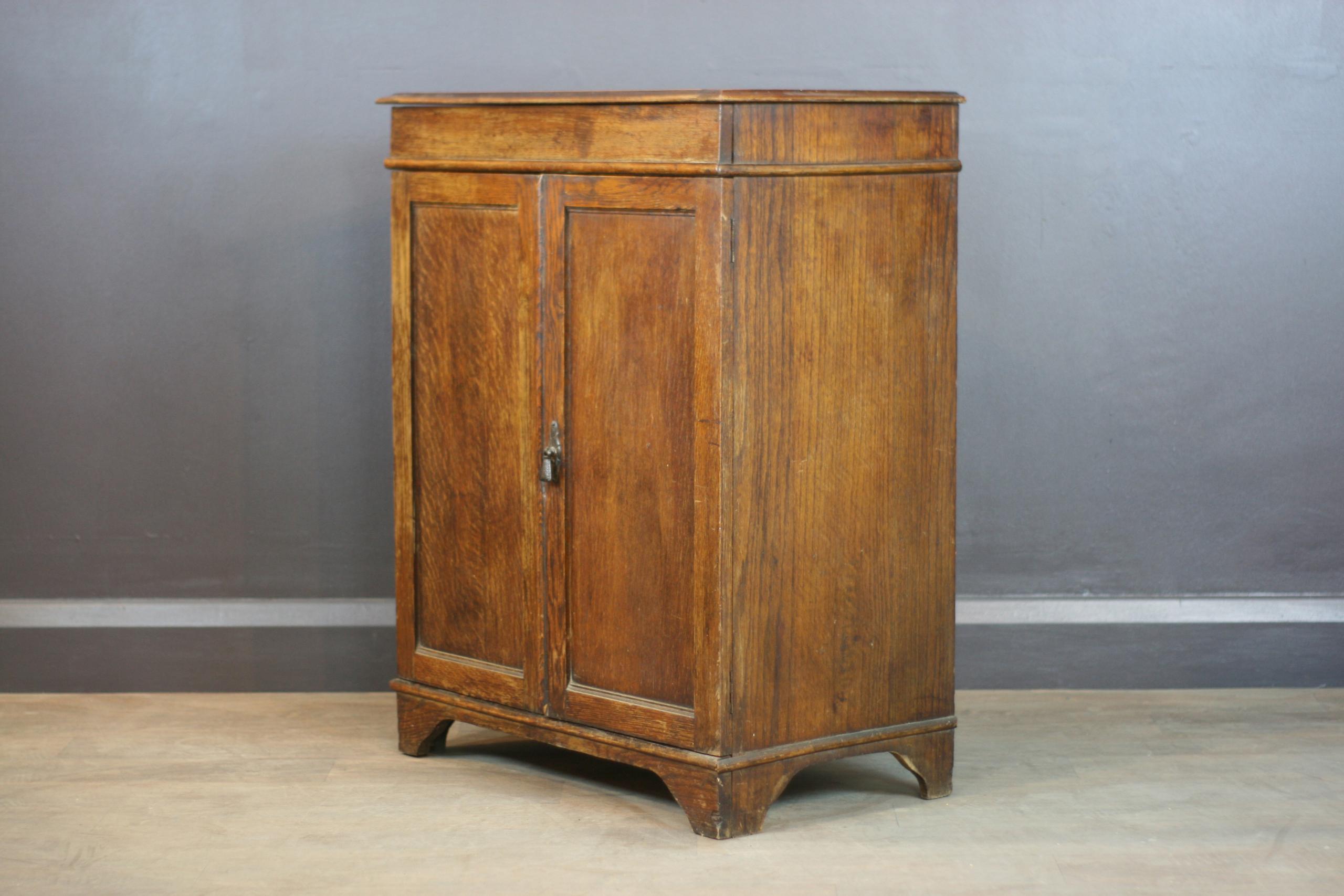 Vintage Cupboard with Doors and Lifting Top Height: 91cm, Width: 71cm, Depth 42cm This item was cleaned and repaired in our London based workshop. Through our traineeship programme this item has provided our beneficiaries with 3 hours of valuable work experience and skills, increasing employability and reducing social isolation. Your purchase will provide a further 1.5 hours for our trainees.