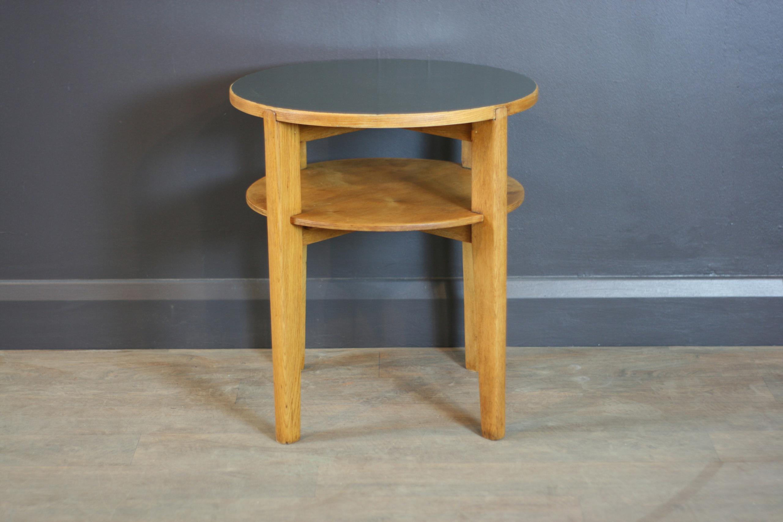 Crafted in the timeless mid-century modern style, this vintage round bar table combines form and function effortlessly.