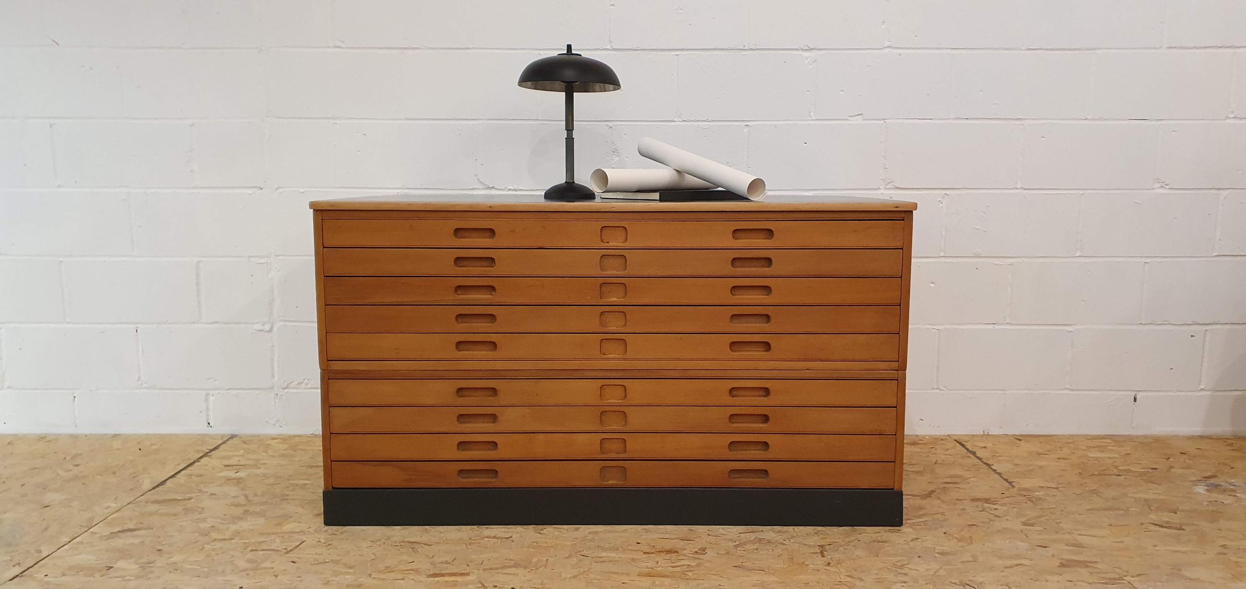 This restored 1960 plan chest is a striking example of mid-century industrial craftsmanship, originally manufactured by Moss Partners and stamped with its maker's mark: “Moss Partners APR1960 21B455.” Built to withstand decades of use, it features nine generous A0-size drawers, ideal for storing blueprints, artwork, maps, or other large-format documents.