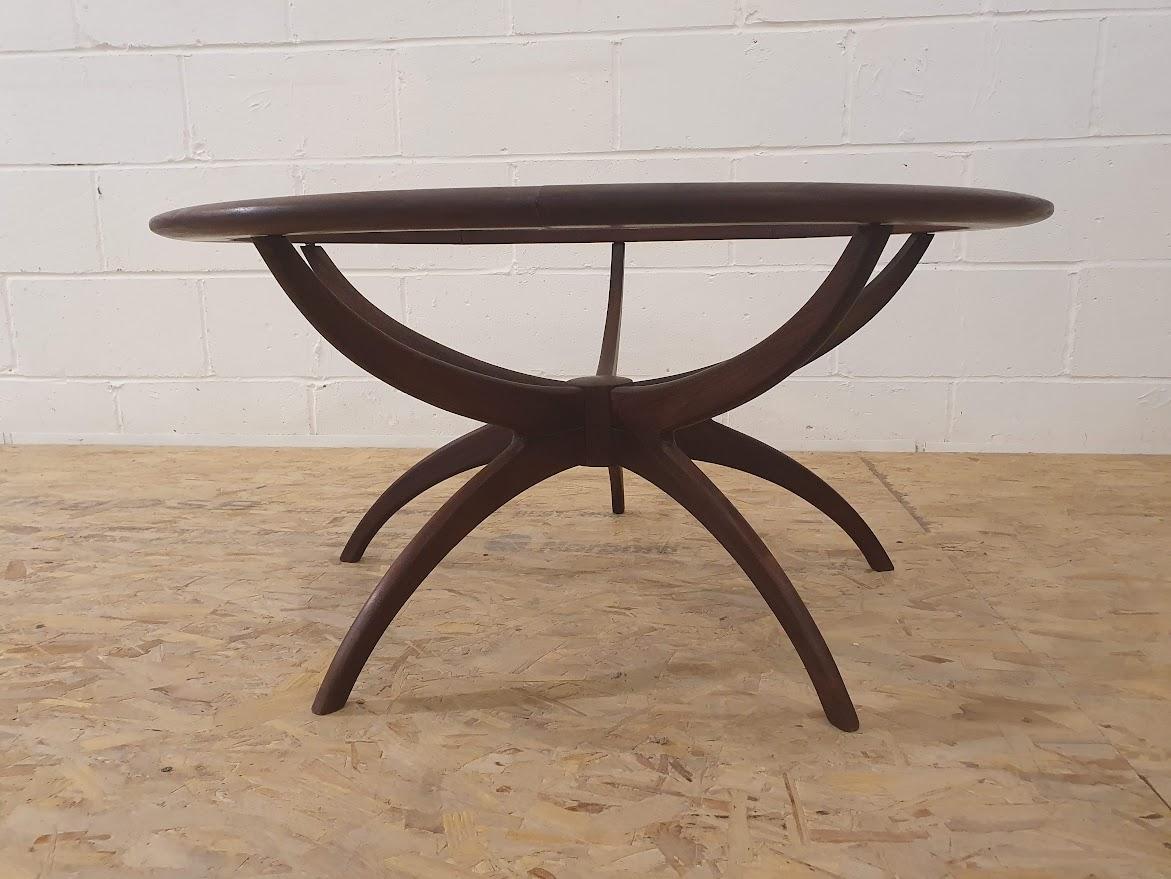Mid century teak spider coffee table fully restored and reassembled by hand, stained in Plum Mahogany and oiled.