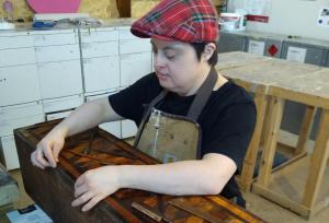 Gemma working on a cabinet