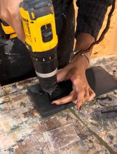 DIY workshop attendee drilling