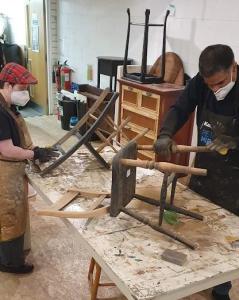 Gemma and Kabir sanding chairs